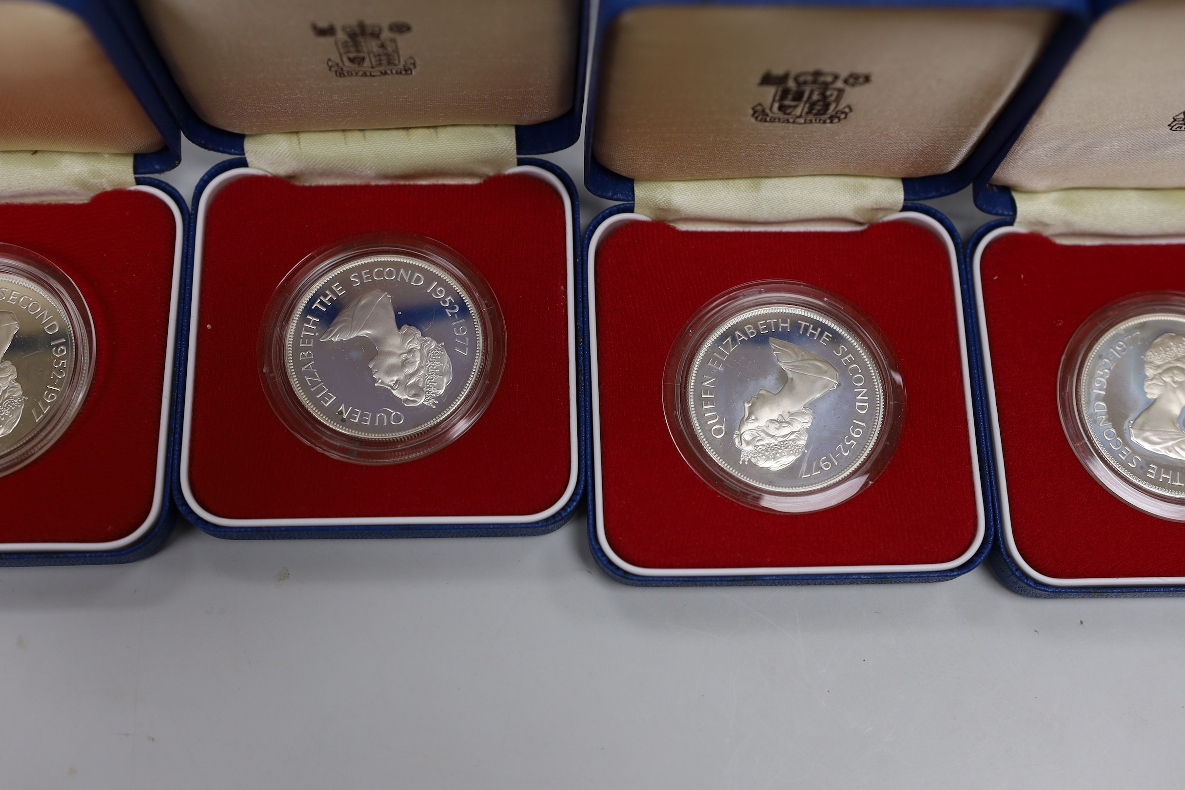 Eleven Royal Mint Commonwealth commemorative proof silver crowns
